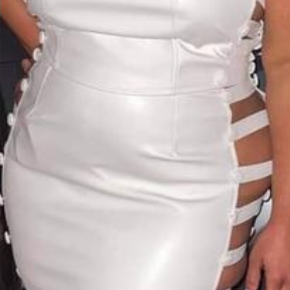 White faux leather 2pc halter top and skirt with slits on side of top and bottom